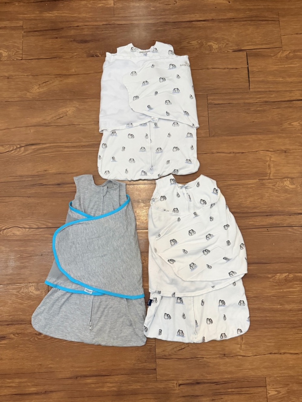 Halo Baby Sleep Sacks and Swaddles in White and Gray with Blue Trim